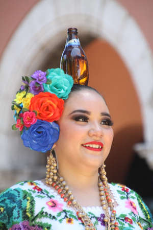 Merida, Mexico - April 21, 2019: Dancers in colourful traditional costumes performing in Merida town square. This is one of the many festivals held throughout the year in Mexico.のeditorial素材