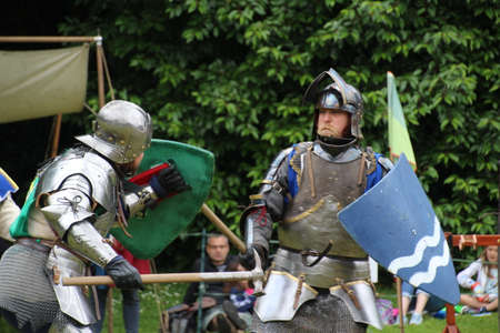 Battle, UK - 14 July, 2019: Knights tournament. Held throughout the Summer at several locations. Four knights re-enactors compete against each other in a series of trials using swords, longbow, mace etc, to establish who is the champion.のeditorial素材