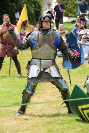 Battle, UK - 14 July, 2019: Knights tournament. Held throughout the Summer at several locations. Four knights re-enactors compete against each other in a series of trials using swords, longbow, mace etc, to establish who is the champion.のeditorial素材