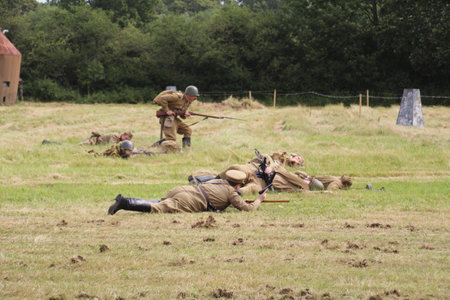 The Solent Overlord Military Collectors Club staging a re-enactment of a second world war battle. The aim is not to glorify war, but to educate the watching public of a by gone eraのeditorial素材