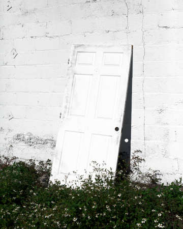 Door on white wall creating depth of perception. Taken in Winter of 2015 in Savannah, Georgia.の写真素材