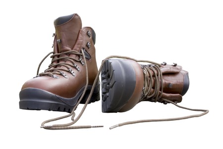 A pair of brand new hiking boots isoltaed on white.Concept prepared, ready, enduring, endurance, ready for anything.の写真素材