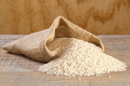 Basmati Rice Spilling from Sackの写真素材