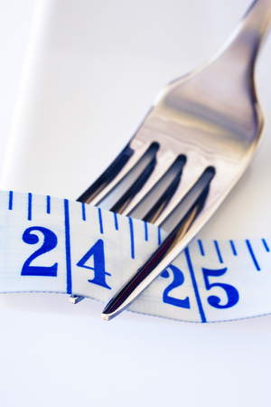 Fork and Tape Measure Showing 24 Inchesの写真素材