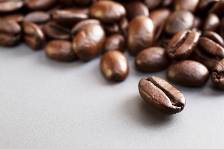 Coffee Beans on Grey Ceramic Surfaceの写真素材