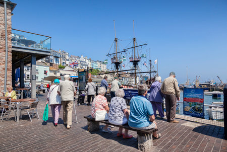 Seniors Relaxing at Brixham Harbourのeditorial素材
