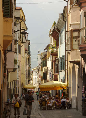 Bolzano, Italy: View of side street and al fresco cafeのeditorial素材