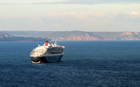 Babbacombe, Devon, England: Cunard flagship Queen Mary 2 is moored off the Devon coast during the coronavirus pandemic after the cruise industry was shut down by Covid 19/のeditorial素材