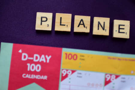 Plan Do Check-In words on wooden cubes on a purple backgroundの写真素材