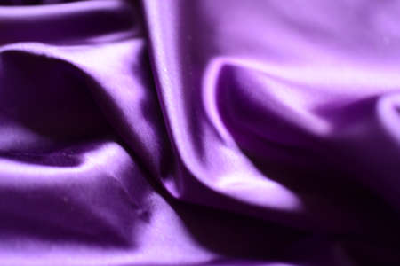 Purple satin fabric as background, closeup. Space for textの写真素材