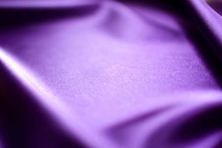 Purple satin fabric as background, closeup. Space for textの写真素材