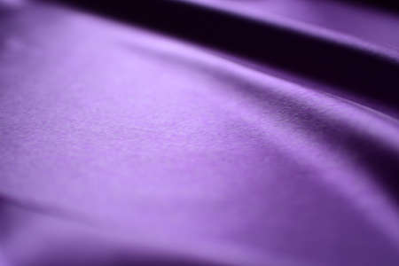 Purple satin fabric texture useful as a background with copy spaceの写真素材