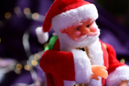 santa claus doll on christmas background with bokehの写真素材