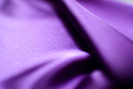purple satin fabric as background, closeup view with selective focusの写真素材