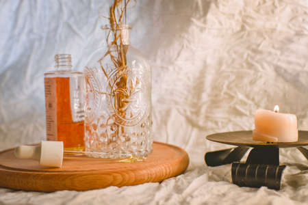 Aromatherapy concept. Aromatherapy essential oil in a glass bottle on a wooden table.の写真素材