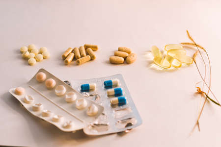 Pills and capsules on a white background. Close-up.の写真素材