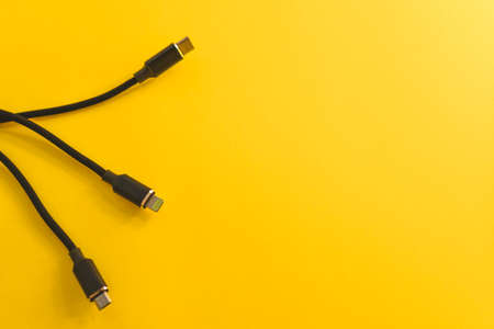 Audio video cable on yellow background. Flat lay, top view.の写真素材
