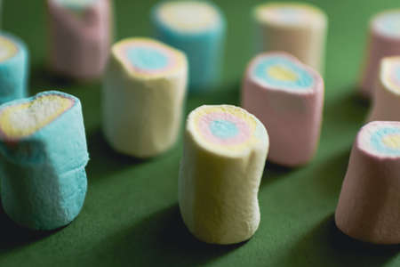 sweet candy pattern on green background with marshmallow . High quality photoの写真素材