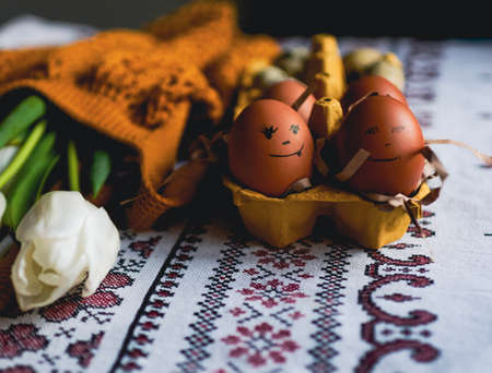 Easter eggs on rustic table with white tulips. high quality photoの写真素材