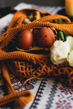 Easter eggs on rustic table with white tulips. high quality photoの写真素材