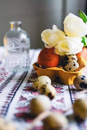 Easter eggs on rustic table with white tulips. high quality photo