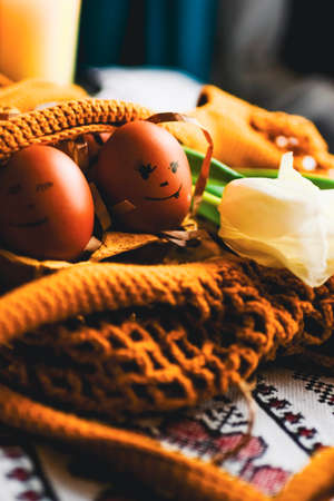 Easter eggs on rustic table with white tulips. high quality photo