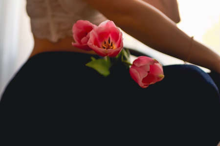 happy woman with spring flowers on window. High quality photo