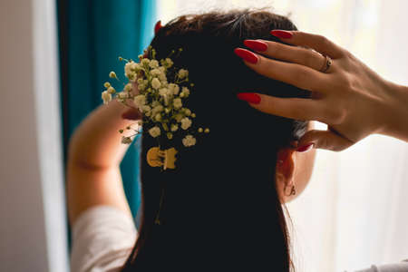 happy woman with spring flowers on window. High quality photo