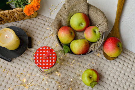 Still life with apples in a basket on a light background, top viewの写真素材