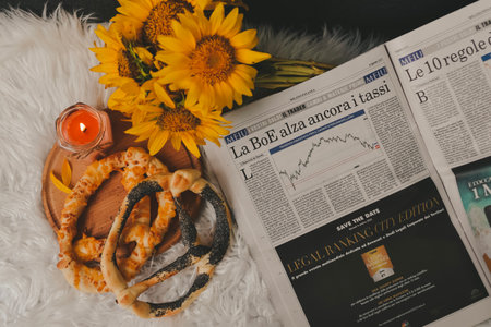 Newspaper, bouquet of sunflowers and pretzelsの写真素材