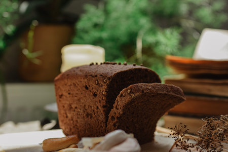 delicious dark bread on the table in the kitchen, still life