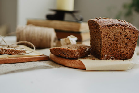 Sliced rye bread on a wooden cutting board, rustic still life