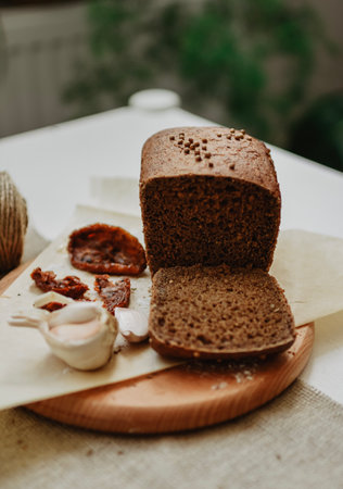 Slices of rye bread on a cutting board. Rustic style.の写真素材