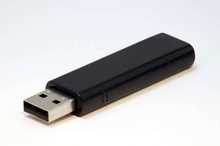 A black usb storage device isolated on white.の写真素材