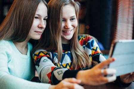 Selfie girls in cafeの写真素材