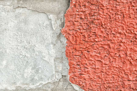 Red, plastered walls with cracks and irregularitiesの写真素材