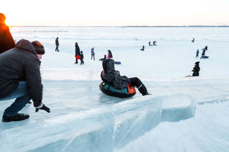 Cheerful people walks in the park in winter.の写真素材