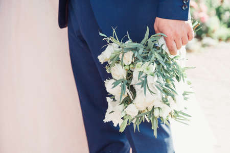 the bride holding a bouquet. wedding flowers. soft focus.の写真素材