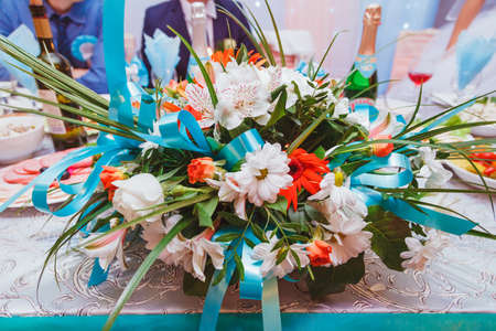 the bride holding a bouquet. wedding flowers. soft focus.の写真素材