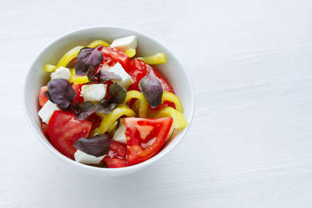 Delicious vegetable salad with feta cheese tomato and pepperの写真素材