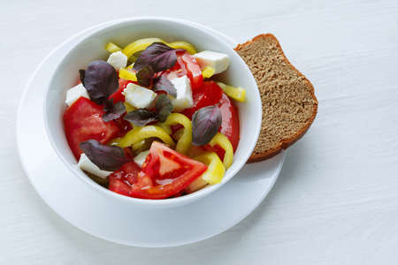 Delicious vegetable salad with feta cheese tomato and pepperの写真素材