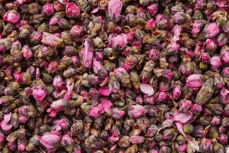Tea flowers texture. Peach blossom tea. Organic dried flower tea leaves.の写真素材