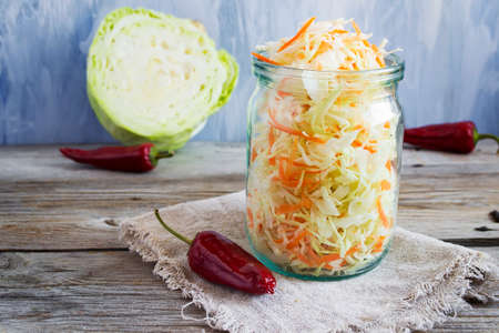 Pickled cabbage with carrots and red hot peppers, selective focucの写真素材