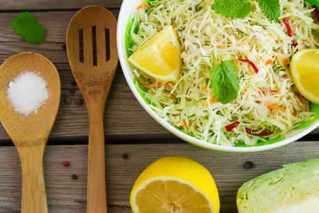 Vitamin cabbage salad with carrots and lemon juice, top viewの写真素材