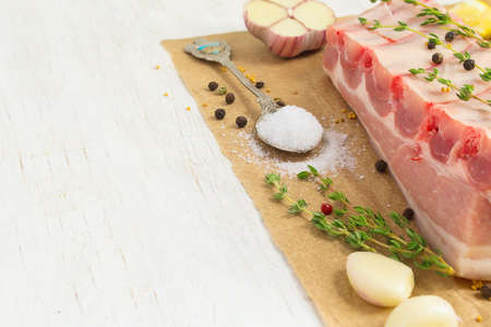 Raw pork ribs with fat and skin, with spices.  Selective focusの写真素材