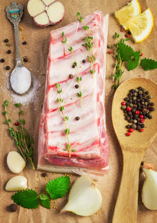 Pork ribs on paper, still life with spices and herbs preparedの写真素材