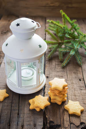 Homemade Christmas cookies stars with ginger and lanternの写真素材