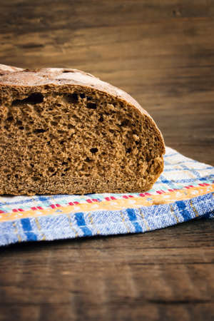 Rye bread on a wooden background
