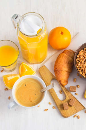 Breakfast concept - orange juice, croissant and coffee on a white background.の写真素材