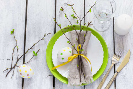 Spring Easter Table setting at white wooden table.